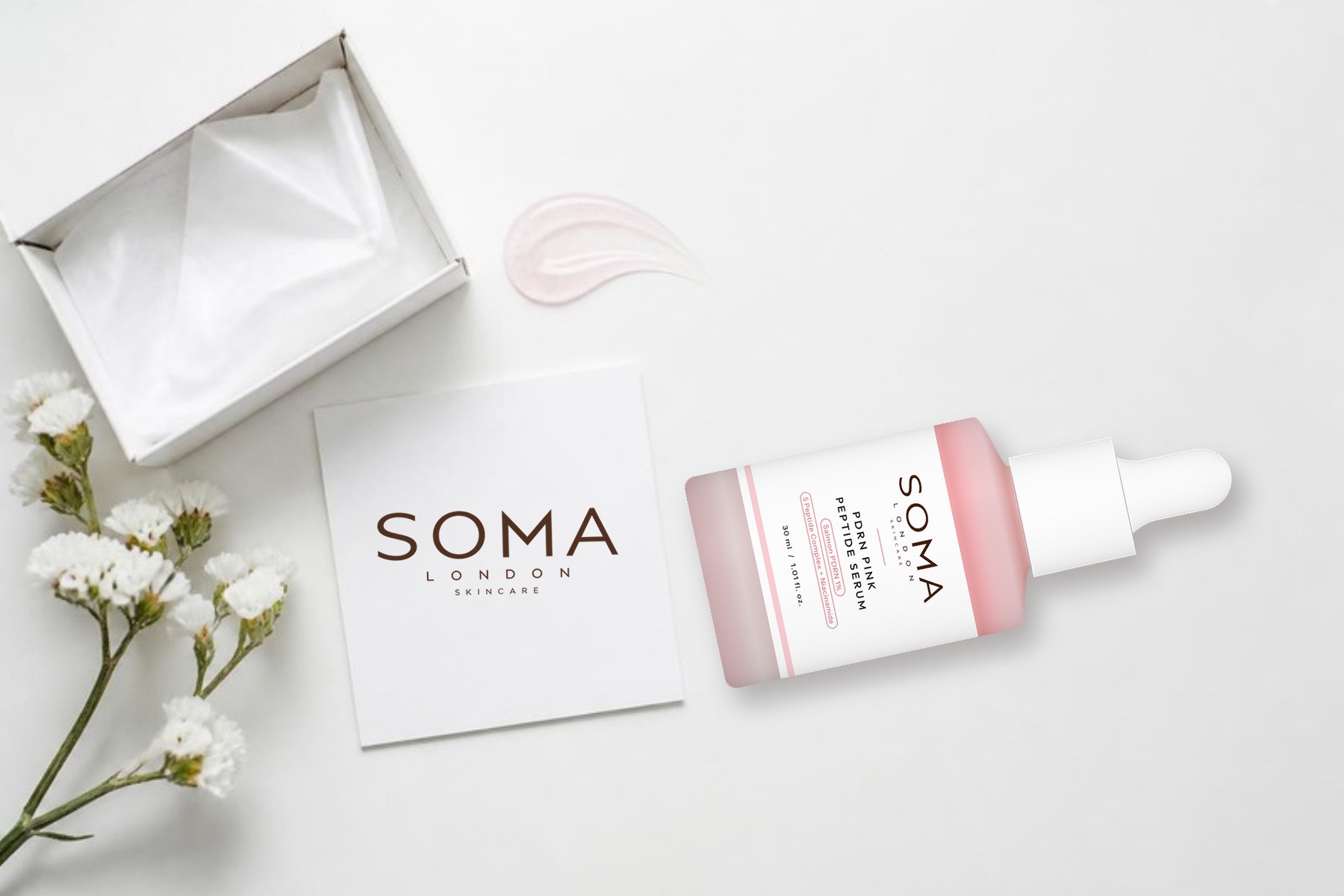 SOMA London PDRN Pink Peptide Serum with a SOMA card and flowers